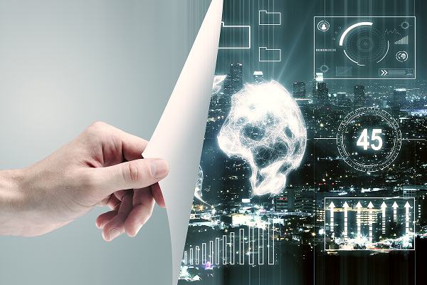 dłoń trzyma stronę i odsłania hologramy